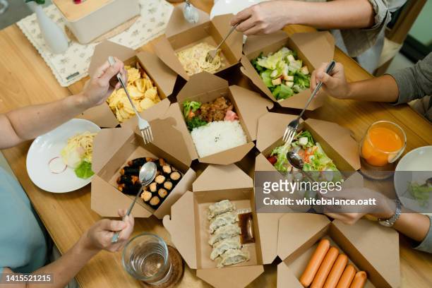 eat at your favorite restaurant together. - order takeout stock pictures, royalty-free photos & images