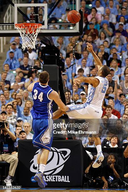 Kendall Marshall of the North Carolina Tar Heels is fouled by Ethan Wragge of the Creighton Bluejays in the second half during the third round of the...