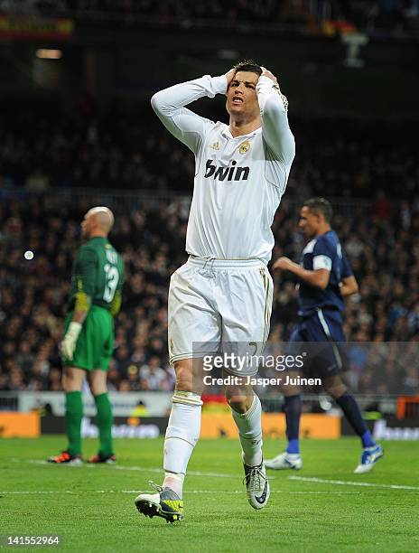 Cristiano Ronaldo of Real Madrid reacts as he fails to score during the la Liga match between Real Madrid CF and Malaga CF at the Estadio Santiago...