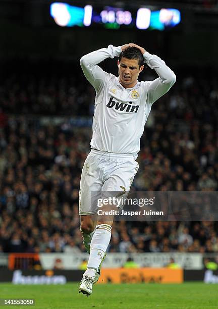 Cristiano Ronaldo of Real Madrid reacts as he fails to score during the la Liga match between Real Madrid CF and Malaga CF at the Estadio Santiago...