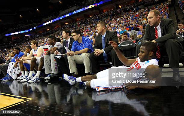 Erving Walker of the Florida Gators looks on as he lies in front of the bench in the second hal against the Norfolk State Spartans during the third...