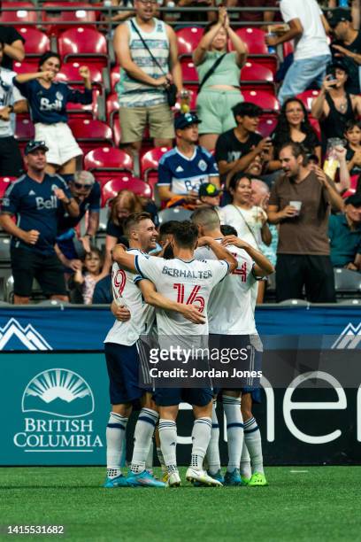 Ryan Gauld of the Vancouver Whitecaps FC celebrates with his teammates after scoring his second goal in the first half against the Colorado Rapids at...