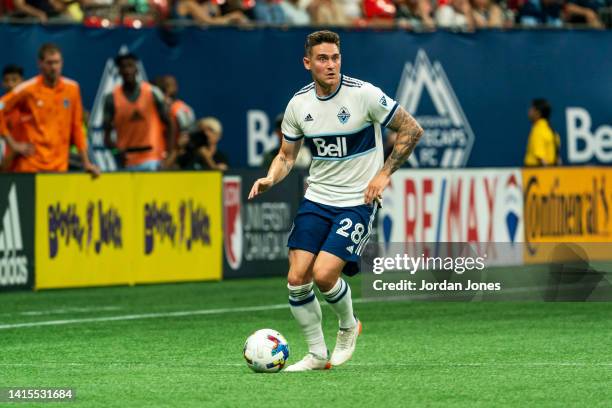 Jake Nerwinski of the Vancouver Whitecaps FC runs with the ball in the second half against the Colorado Rapids at BC Place on August 17, 2022 in...