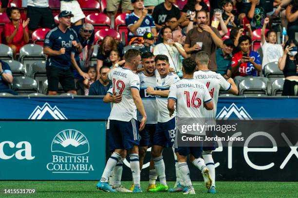 Ryan Gauld of the Vancouver Whitecaps FC celebrates with his teammates after scoring his second goal in the first half against the Colorado Rapids at...