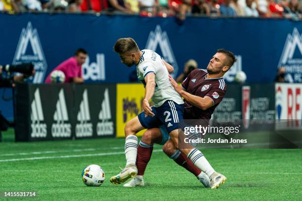 Marcus Godinho of the Vancouver Whitecaps FC fights for the ball with Diego Rubio of the Colorado Rapids at BC Place on August 17, 2022 in Vancouver,...