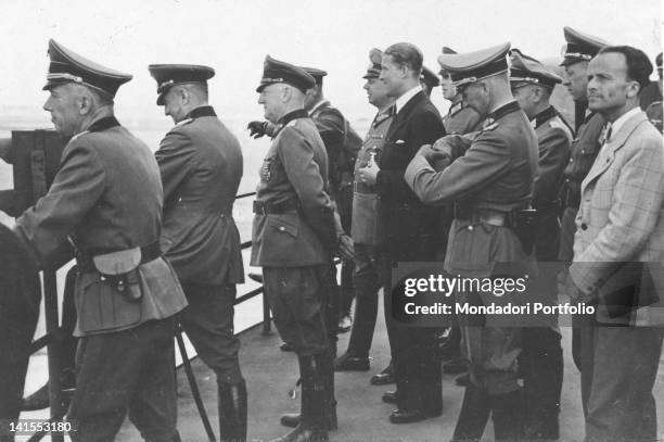 The German inventor of the V2 missiles Wernher von Braun watching the launch of the missile with Field Marshal Walther von Brauchitsch. Peenemunde,...