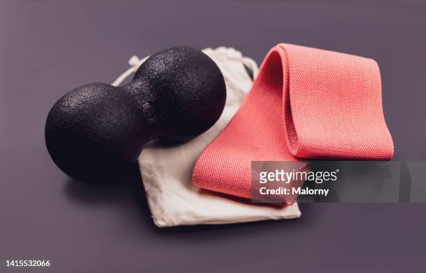 resistance band and blackroll on black background. - blackroll stock pictures, royalty-free photos & images