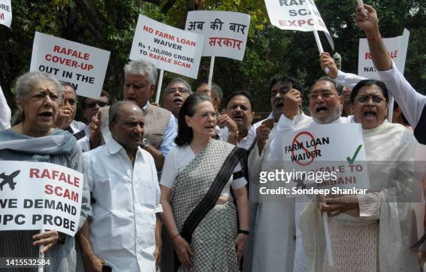 Sonia Gandhi wearing a black arm band joins Congress and other opposition MP's protest against corruption in the Rafael fihter aircraft deal with a...
