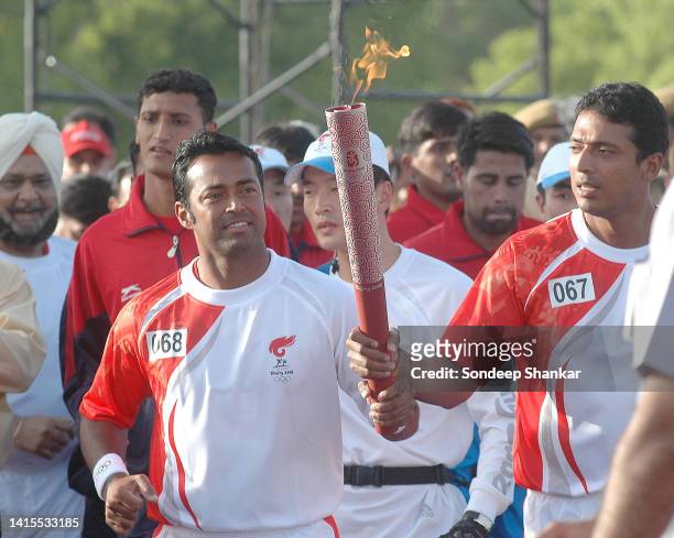 Tennis pair Leander Paes and Mahesh Bhupati running the last leg of he Olympic Relay on Rajpath in New Delhi on Thursday April 17, 2008.