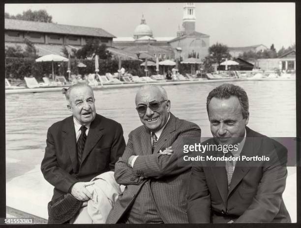 The publisher Arnoldo Mondadori at the Isola di San Giorgio with the two Italian writers Aldo Palazzeschi and Giorgio Bassani. Venice, 1968