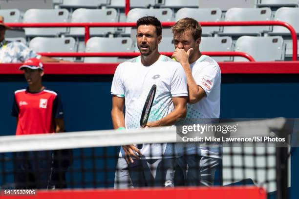 Kevin Krawietz of Germany and Andreas Mies of Germany talk between points against Neal Skupski of Great Britain and Wesley Koolhof of The Netherlands...