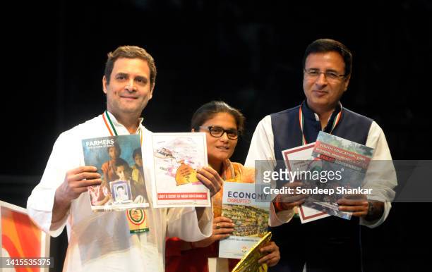Congress President Rahul Gandhi accompanied by party leaders Sushmita Deb and Randeep Singh Surjewala releasing documents on issues like poverty,...