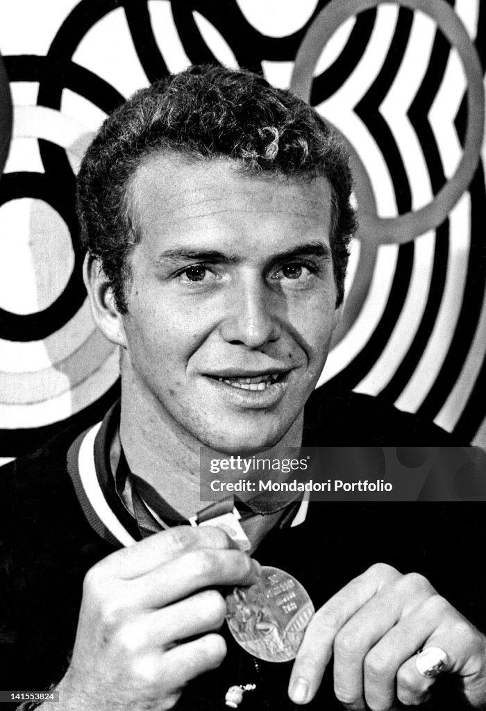 Klaus Di Biasi Showing The Olympic Medal