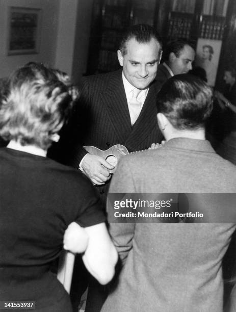 The writer and journalist Alberto Moravia at the home of Alberto Lattuada, cinema director, screenwriter, actor and producer