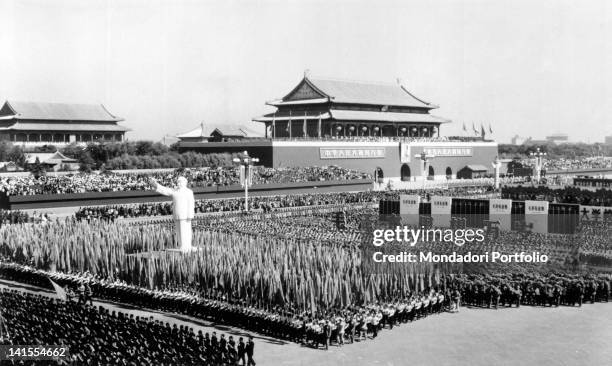 Crowd attending a parade of the Communist Party of China in Tienanmen Square. Beijing, 1960s