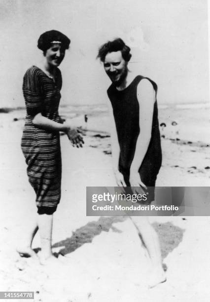 British writer Virginia Woolf laughing on the beach with her brother-in-law Clive Bell. 1910s