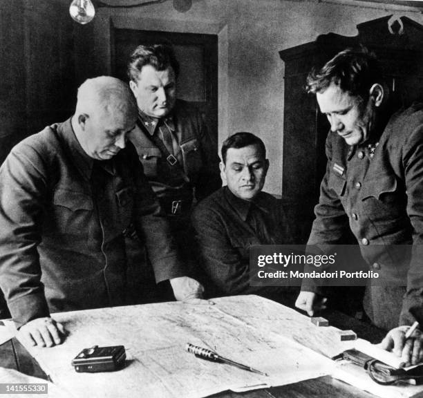 Nikita Khrushchev, Andrej Eremenko and other officers studying military strategy during the siege of Stalingrad, today Volgograd. Stalingrad, August...