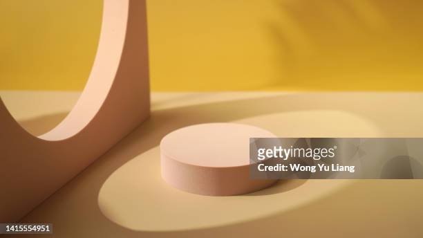 wooden podium block with shadows ,abstract photography for product placement - rounded cube bildbanksfoton och bilder
