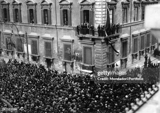 The Italian head of the government Benito Mussolini speaking to the crowd gathered in Piazza Colonna from a balcony of Palazzo Chigi after a period...