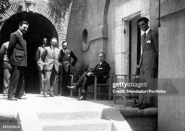 The Italian head of the government Benito Mussolini and other fascist leaders being in the courtyard of the Sangallo castle before signing the...
