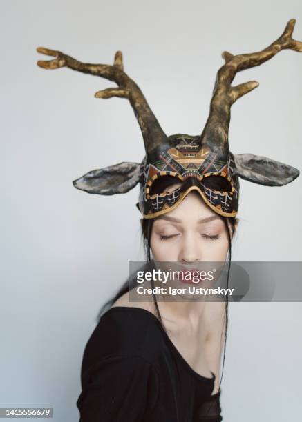 young beautiful woman with deer skull - hunting horn stock pictures, royalty-free photos & images