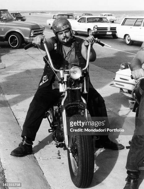Galveston 'Bandido', or a Texan boy who's inspired by the California-based Black Angels gang, sitting on his motorcycle. Texas, USA, September 1969