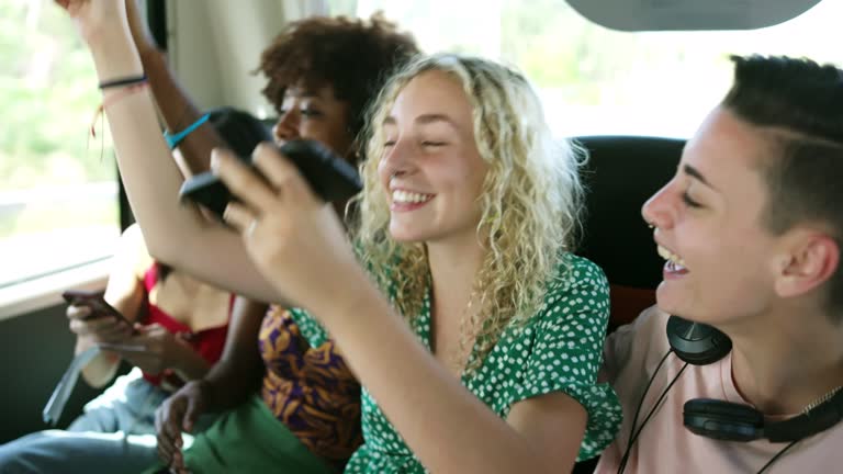 https://media.gettyimages.com/id/1415557580/video/carefree-friends-enjoying-music-onboard-deluxe-motor-coach.jpg?b=1&s=640x640&k=20&c=sxgaeyvhHaati7a7BMGugd5z5sc88cuCct7r5-cIvuc=