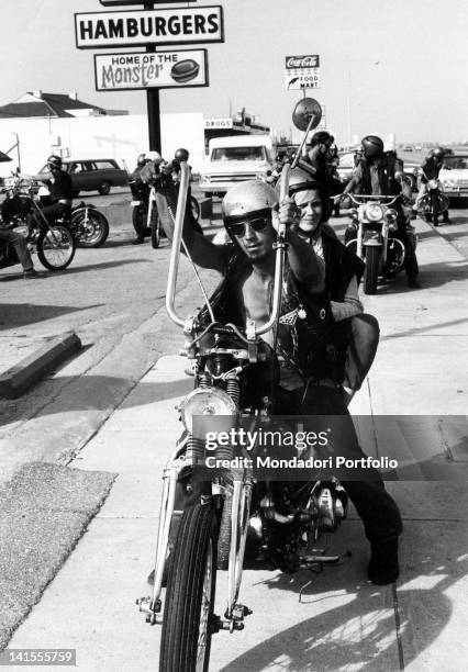 Group of Galveston 'Bandidos', or Texan boys who are inspired by the California-based Black Angels gang, sitting on their motorcycles. Texas, USA,...