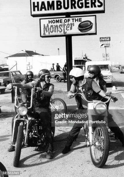 Group of Galveston 'Bandidos', or Texan boys who are inspired by the California-based Black Angels gang, sitting on their motorcycles. Texas, USA,...