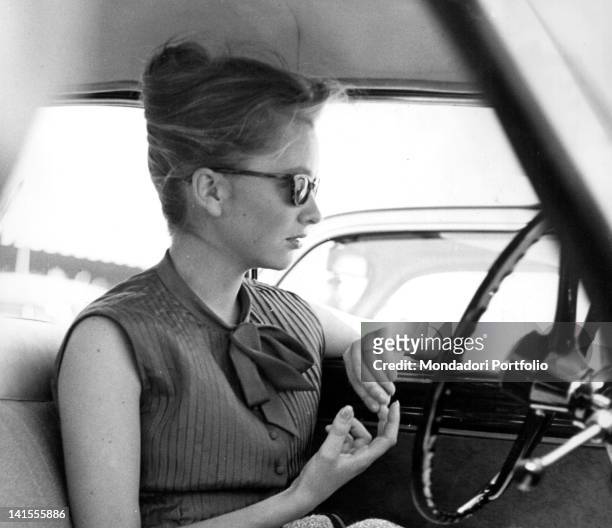Princess Paola of Calabria, wife of Prince Albert II of Belgium, in a car. Rome, 1961