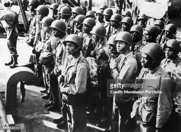 American marines in field dress waiting on board a ship before landing on the shore of Okinawa. Okinawa, 1945