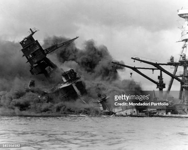 The American battleship 'Arizona' on fire sinking after the Japanese attack on Pearl Harbor. Pearl Harbor, 7th December 1941