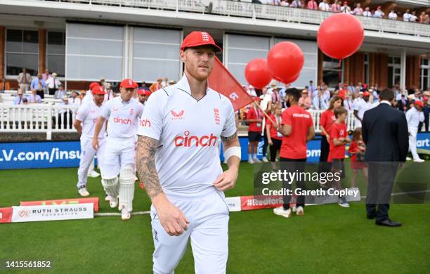 England captain Ben Stokes leads out his team wearing his Red For Ruth cap ahead of day two of the First LV= Insurance Test Match between England and...