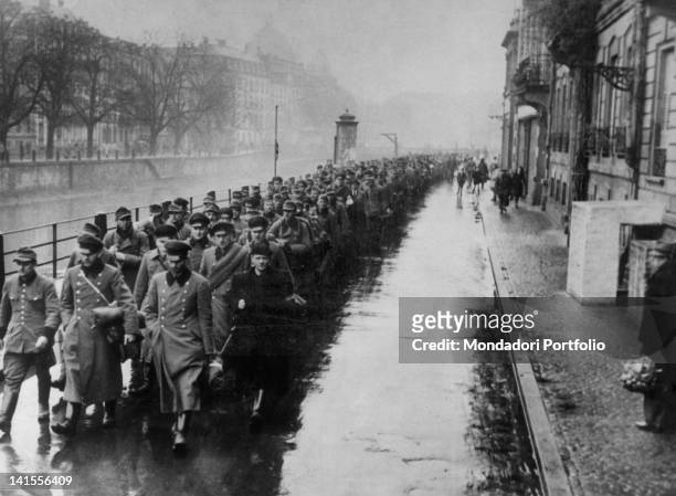 French partisans escorting the Gestapo members who have been captured at the end of operations for the occupation of the city. Strasbourg, 20th...