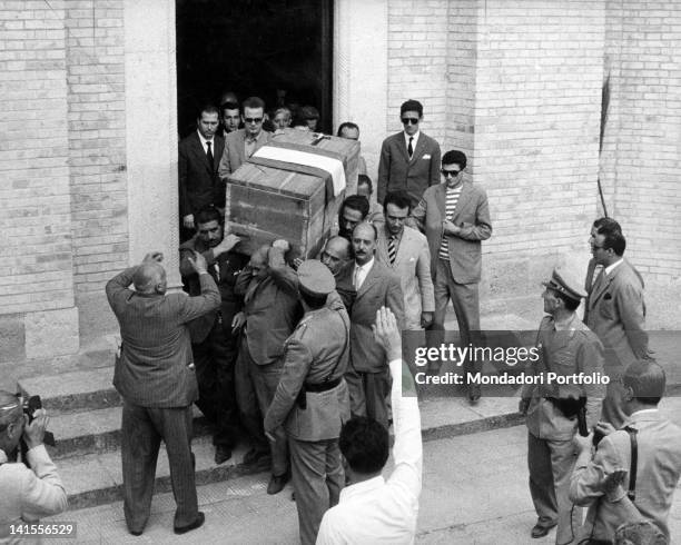 The coffin containing the remains of Benito Mussolini is moved from the family chapel to the crypt in San Cassiano in Pennino, in the presence of...