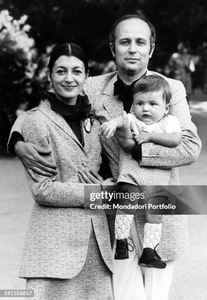 The Italian ballerina Carla Fracci posing with her husband Beppe Menegatti and her son Francesco in Milan. 1970s