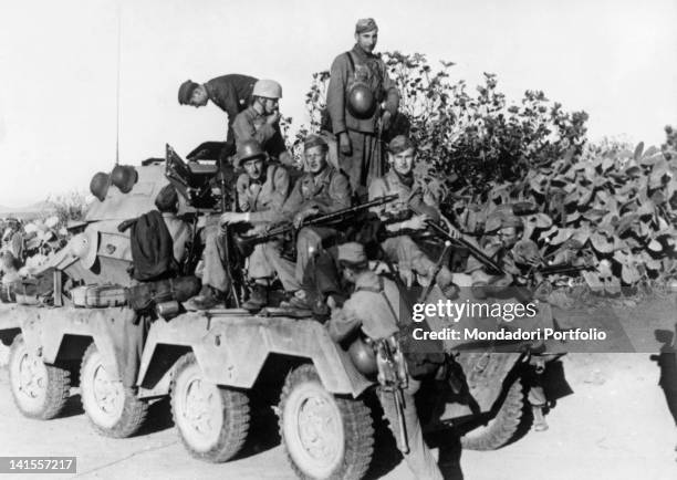 Shock troops of the Luftwaffe and German paratroopers making their way in an armoured vehicle to the front of the outposts in central...