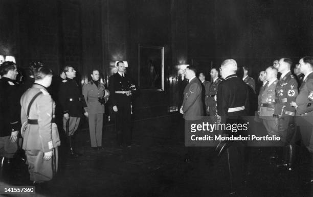 On the tenth anniversary of the Nazis seizure of power in Germany, Adolf Hitler and other Nazi leaders in Berlin receiving a delegation of the...