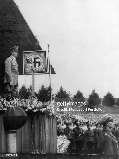 The Chancellor of the Third Reich Adolf Hitler speaking before the crowd filling the stands of the stadium in Nuremberg.áNuremberg, 10th August 1938