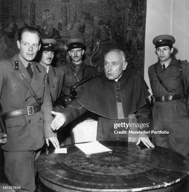 General Paul Maleter and other rebel officers talking with Cardinal Jozsef Mindszenty in a room of the archbishop's palace in Budapest. Budapest,...