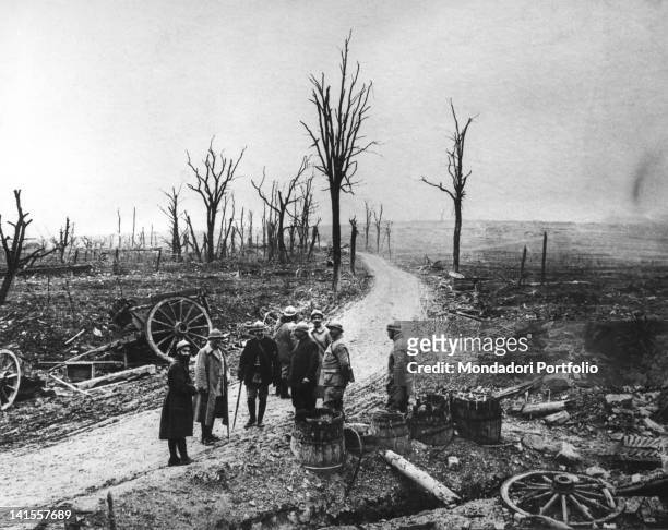 Soldiers watching skeletal trees, ruins and rubble at the end of the Battle of Verdun. Verdun, December 1916