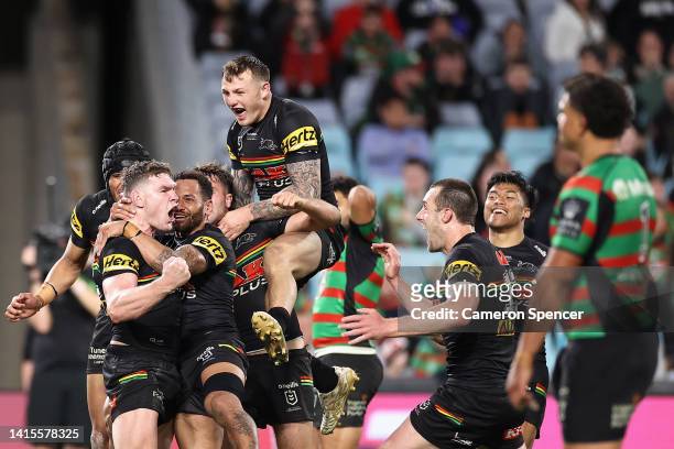 Liam Martin of the Panthers celebrates scoring a try with team mates during the round 23 NRL match between the South Sydney Rabbitohs and the Penrith...