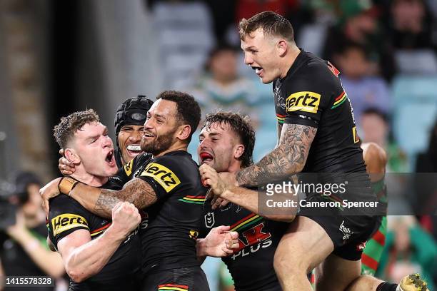 Liam Martin of the Panthers celebrates scoring a try with team mates during the round 23 NRL match between the South Sydney Rabbitohs and the Penrith...