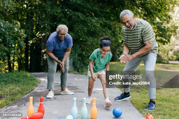 companionship and social engagement for seniors - lawn bowling stock pictures, royalty-free photos & images