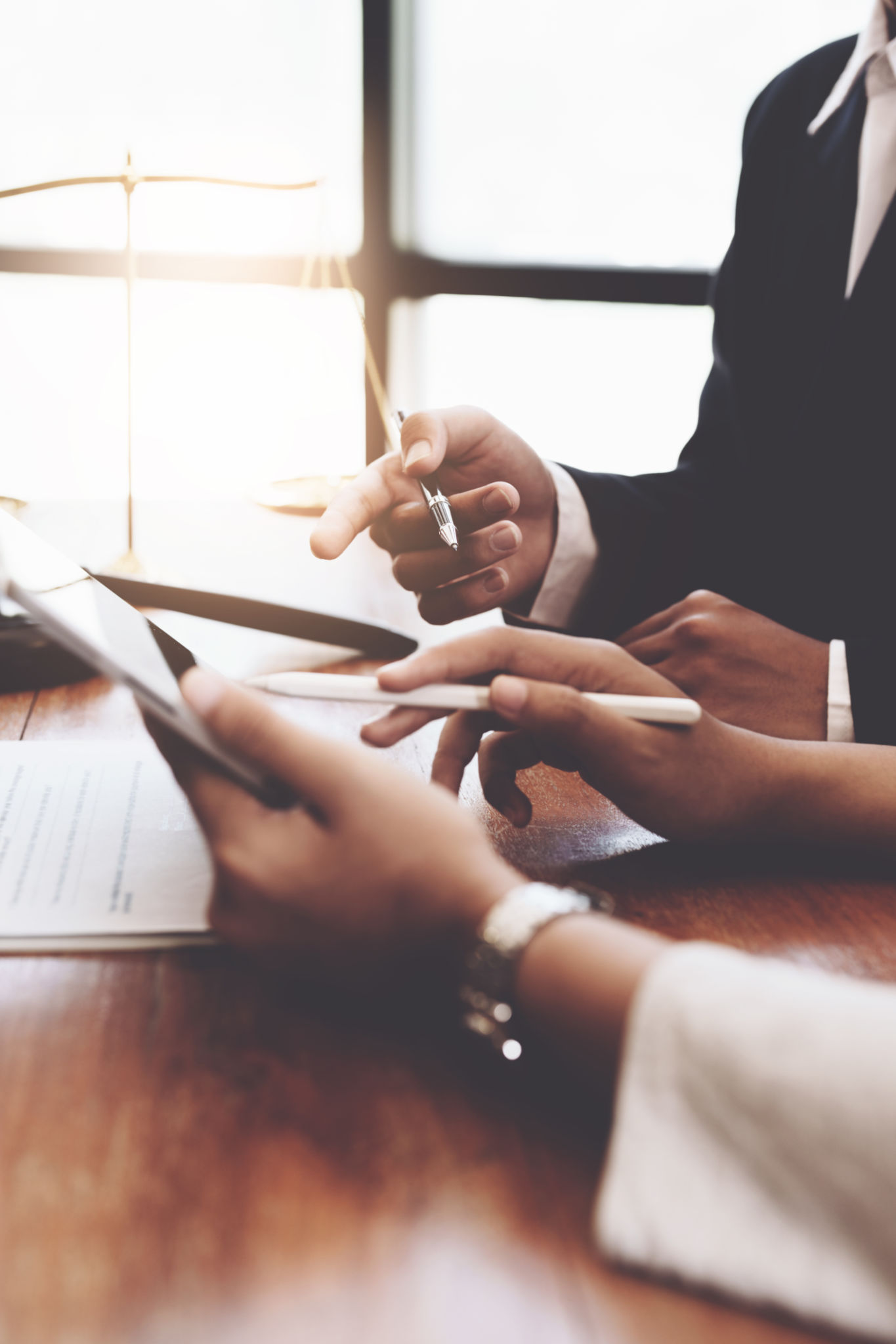 The client is consulting with a lawyer on legal matters The client is consulting with a lawyer on legal matters