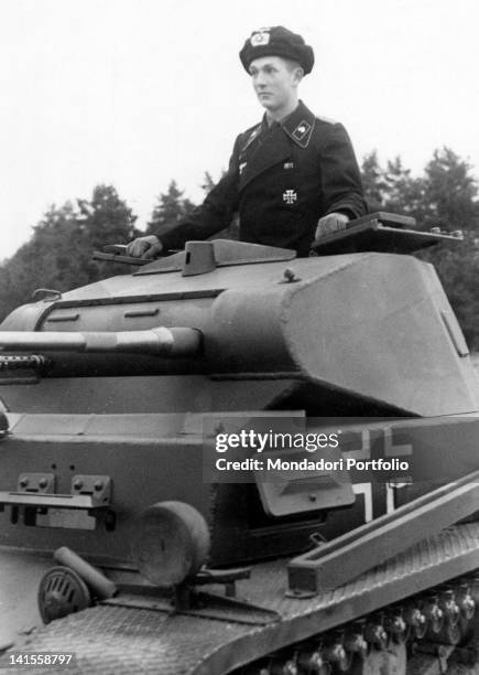 German soldier coming out the cupola of his tank during training in the area of Wunstorf. Hannover, October 1939