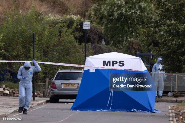 Forensic officers at the scene where Thomas O'Halloran used to busk on August 18, 2022 in the Greenford area of London, England. Thomas O'Halloran...