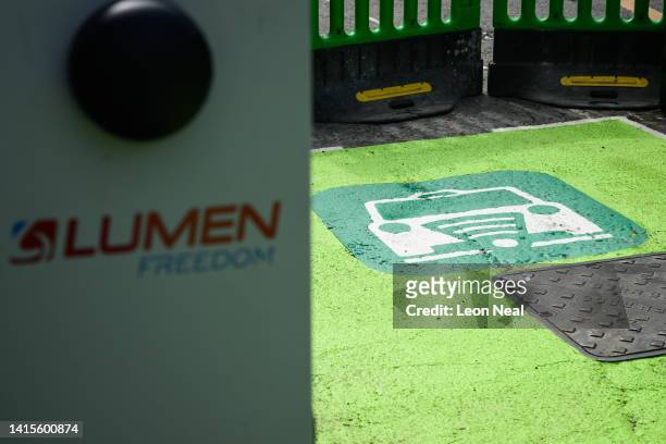 The logo for Australian technology company Lumen Freedom is seen on a taxi rank featuring wireless electric charging pads on August 18, 2022 in...