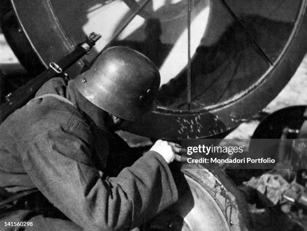 German soldier fixing a photoelectric battery not far from the Seversky Donets basin, on the Southern Russian front. March 1942