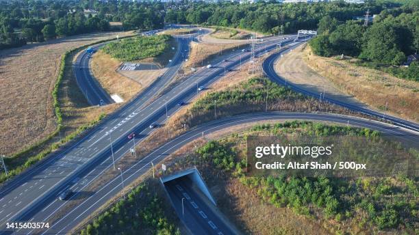 luton airport junction interchange of motorways m1 j10 luton england,british highways at sunset,stockwood park,united kingdom,uk - stockwood discovery centre stock pictures, royalty-free photos & images